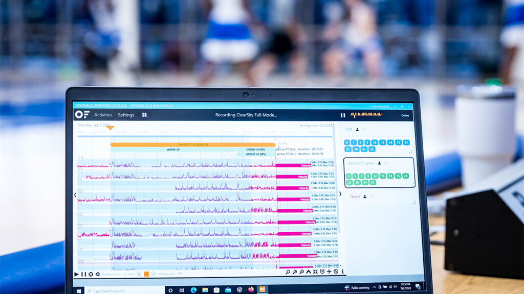 Computer on a sports bench displaying real-time analytics data during a training session, exemplifying the use of technology in sports