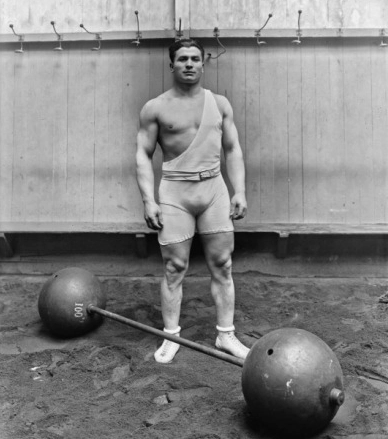 Ernest Cadine, halterofilista francês e campeão olímpico de 1920 na prova de levantamento com as duas mãos [6].